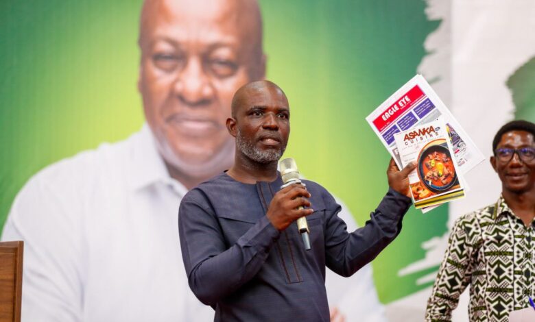 Dr. Daniel Edem Adzovie, displaying the creative projects of some students.